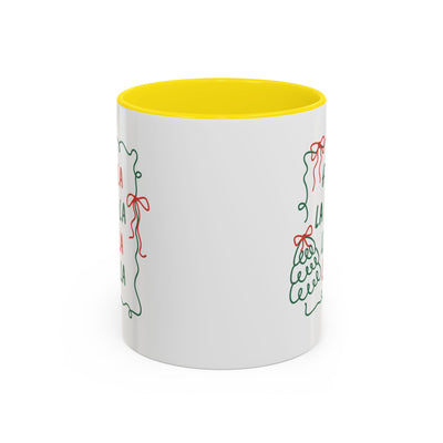 White ceramic Fa La La Christmas coffee mug with yellow interior and festive minimalist holiday design