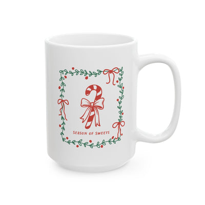 White ceramic Season of Sweets mug with green border and candy cane design, available in 11oz and 15oz sizes