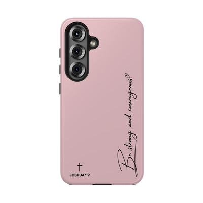 Pink inspirational tough phone case with "Be strong and courageous" text and Joshua 1:9 verse, durable dual-layer protection for iPhone and Samsung models.