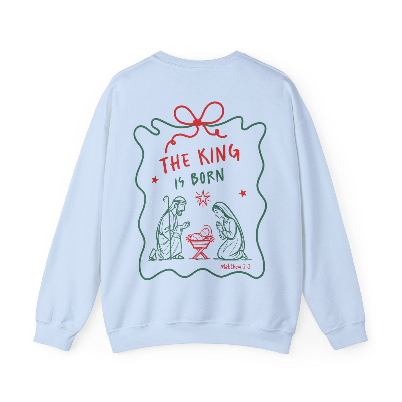 Light blue Coquette Bow Crewneck Sweatshirt with festive "The King is Born" faith design and nativity illustration on the back.