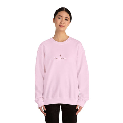 woman wearing light pink Fall Things Sweatshirt cozy minimalist autumn crewneck