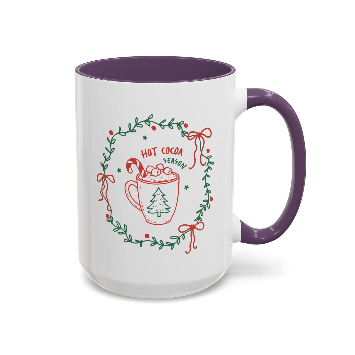 white ceramic mug with purple handle and interior featuring hot cocoa season design with greenery wreath and festive red accents