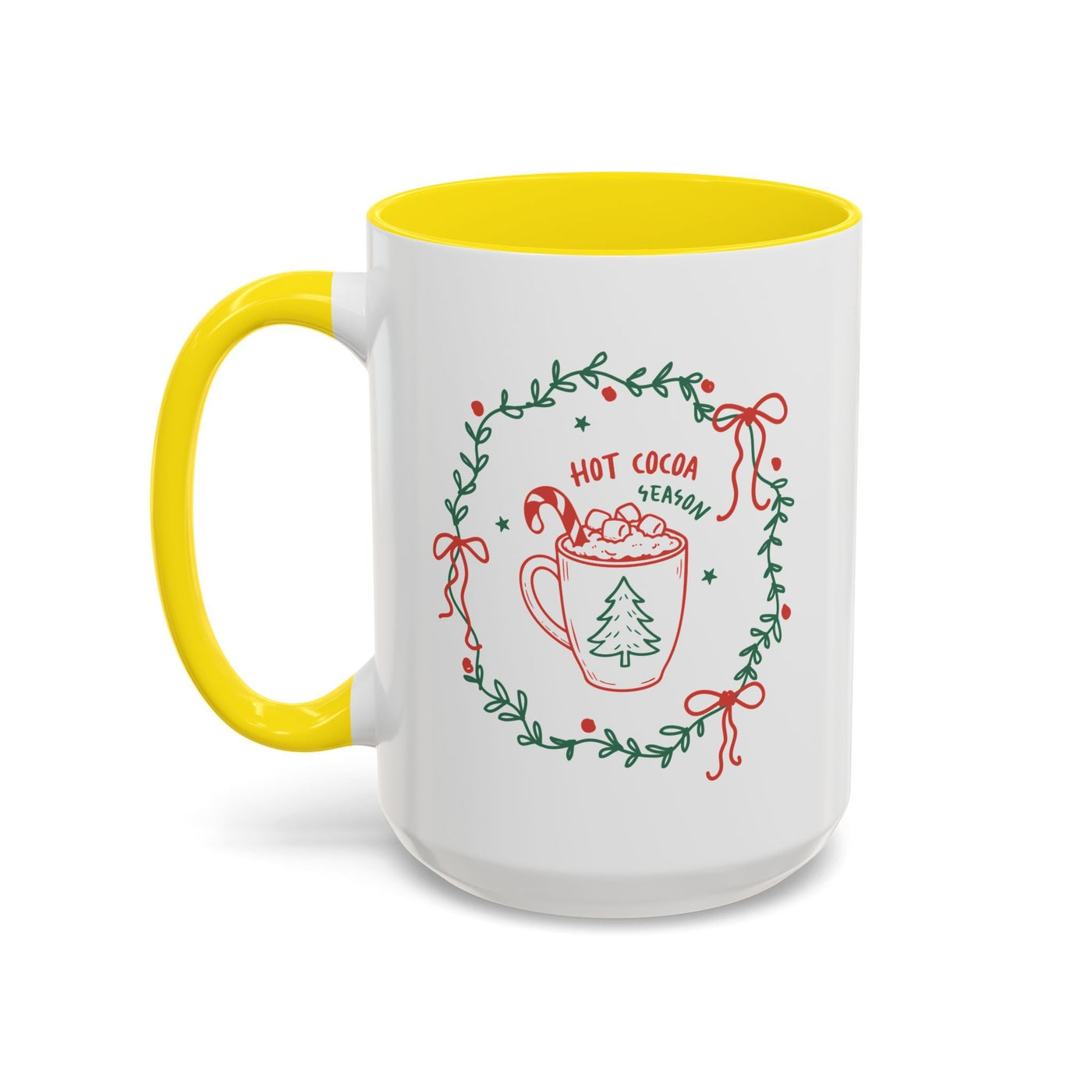 white ceramic mug with yellow interior and handle featuring hot cocoa season holiday design with greenery wreath