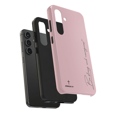 Inspirational tough phone cases with "Be Strong and Courageous" Joshua 1:9 design, durable dual-layer protection, available in pink and black for iPhone and Samsung models