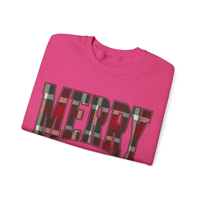 Folded red crewneck sweatshirt with plaid "MERRY" Christmas graphic design