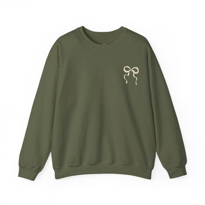 Unisex olive green Coquette Christmas Faith crewneck sweatshirt with bow design on chest, cozy cotton-poly blend, ribbed collar, festive holiday wear