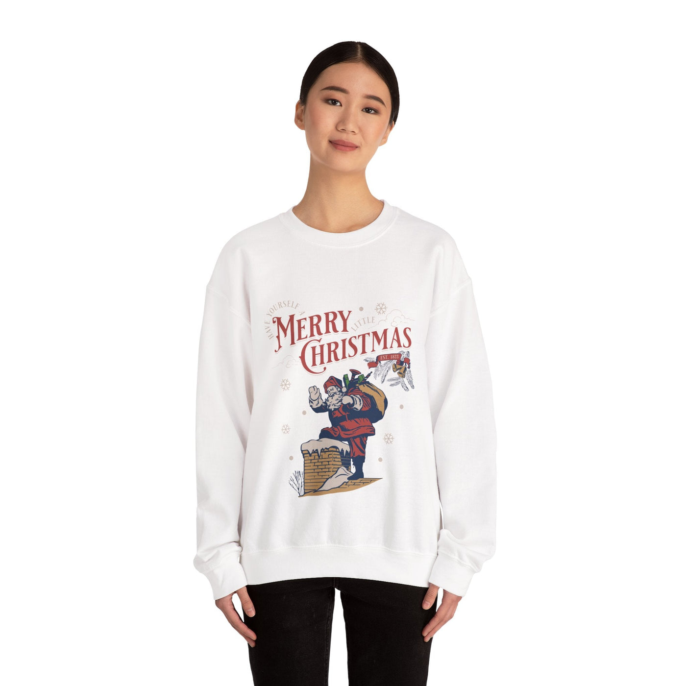 woman wearing white vintage Santa crewneck sweatshirt with Santa carrying gift bag going into chimney and Merry Christmas text