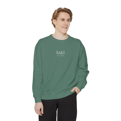 Cozy unisex garment-dyed sweatshirt with minimalist tree embroidery and ribbed cuffs in green