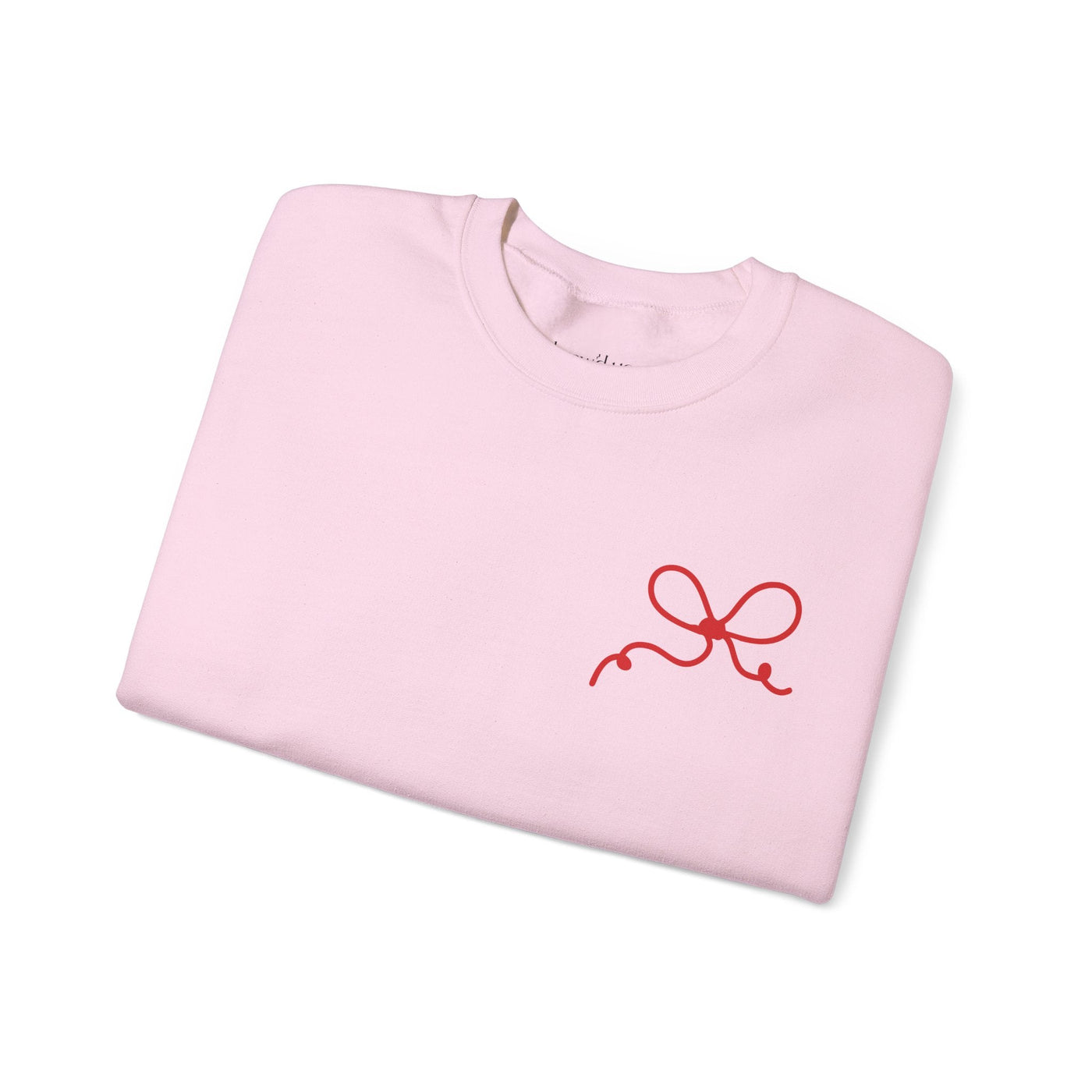 Folded pink Coquette Bow Crewneck Sweatshirt with small red bow design on front