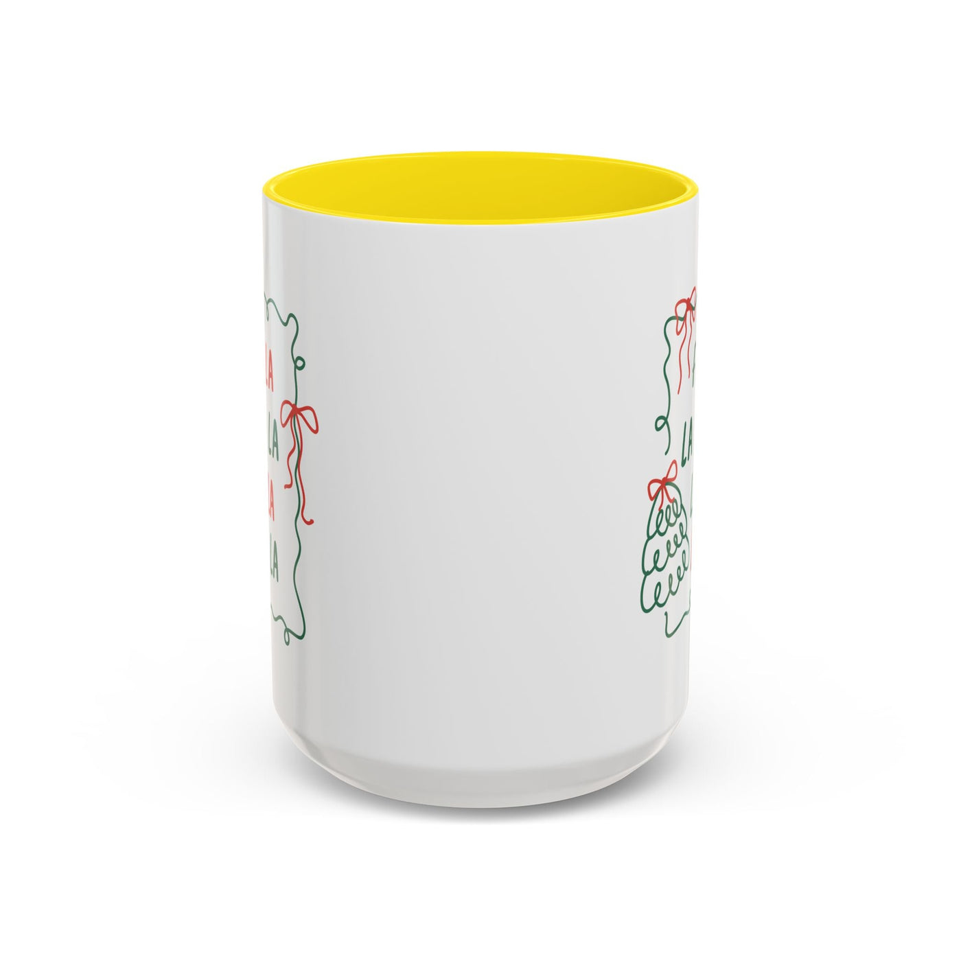 White ceramic Fa La La Christmas coffee mug with yellow interior and minimalist holiday design, microwave and dishwasher safe