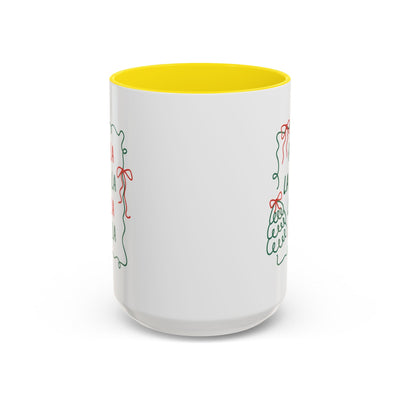 White ceramic Fa La La Christmas coffee mug with yellow interior and minimalist holiday design, microwave and dishwasher safe