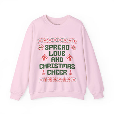 Cozy pink crewneck sweatshirt with "Spread Love and Christmas Cheer" holiday design, unisex festive sweater.