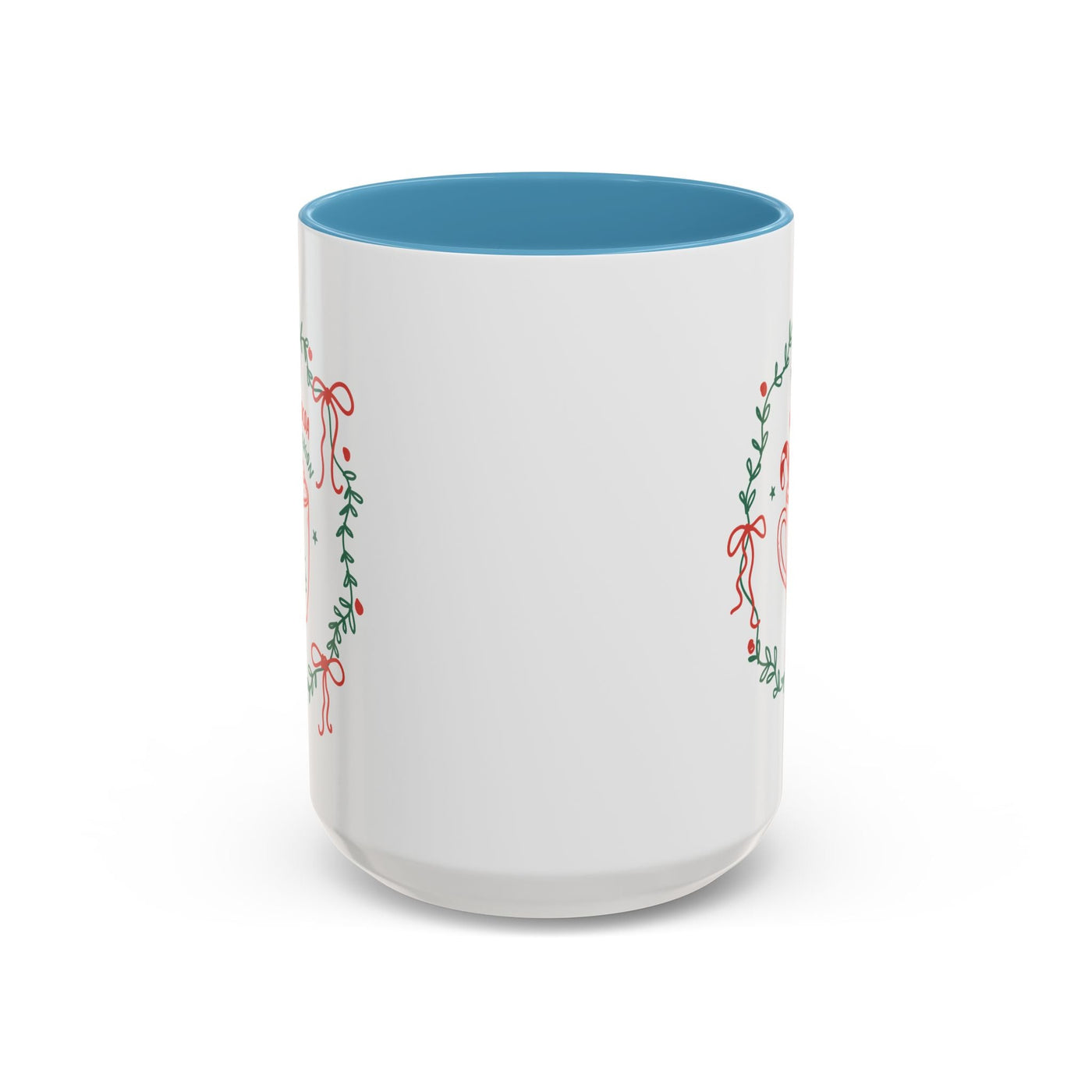 White ceramic mug with blue interior and festive greenery design