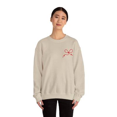 Coquette Bow Crewneck Sweatshirt with red bow design on beige fabric, casual unisex fit