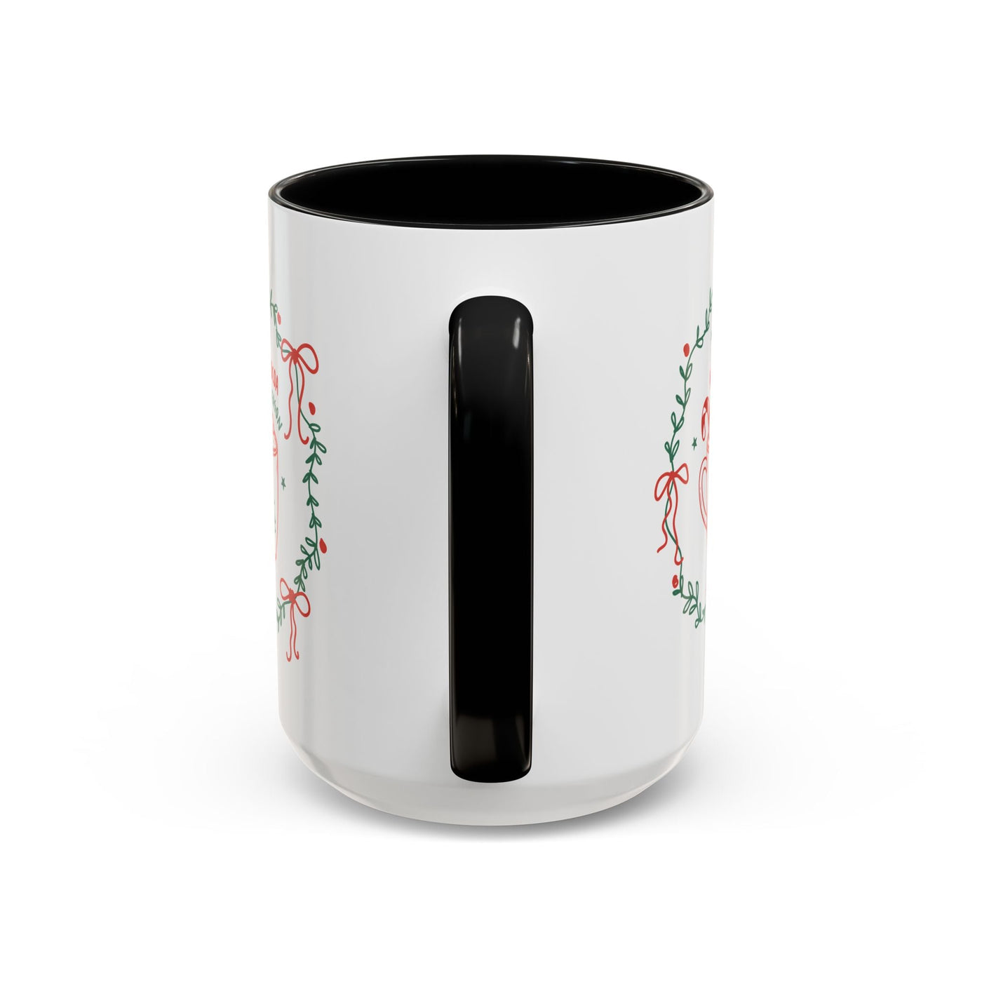 White ceramic mug with black handle and interior, featuring festive greenery design
