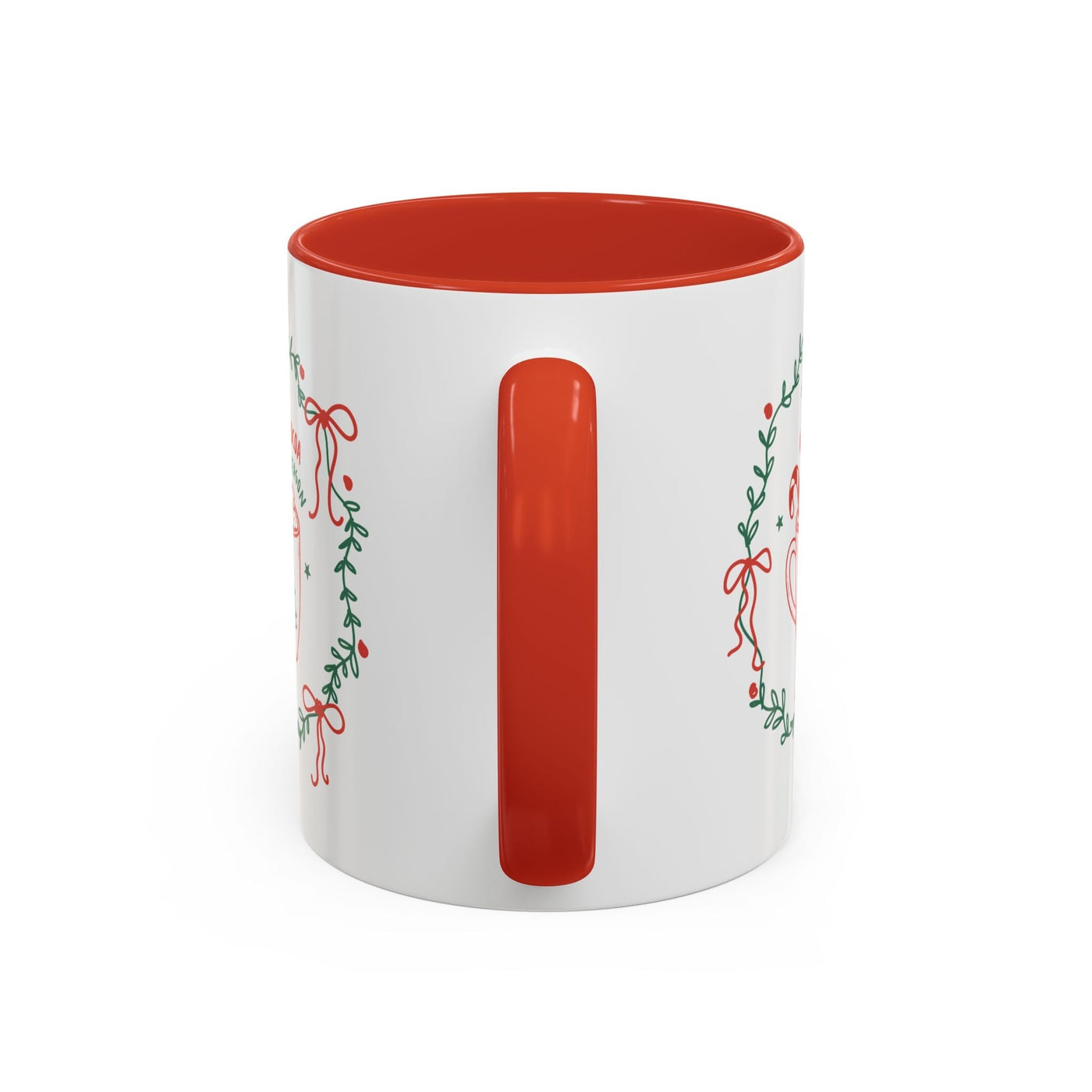 White ceramic mug with red interior and handle, festive greenery and bow design, available in 11oz and 15oz sizes