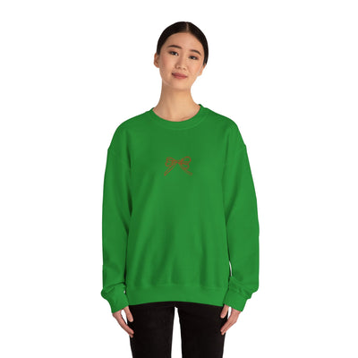 Green Holiday Bow crewneck sweatshirt with festive bow design, classic fit, and long sleeves worn by female model