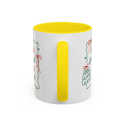 White ceramic Fa La La Christmas coffee mug with yellow handle and interior, minimalist holiday design, dishwasher and microwave safe