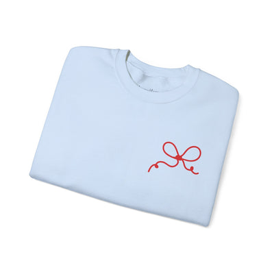 Light blue Coquette Bow Crewneck Sweatshirt with red bow design on front and festive "The King is Born" theme.