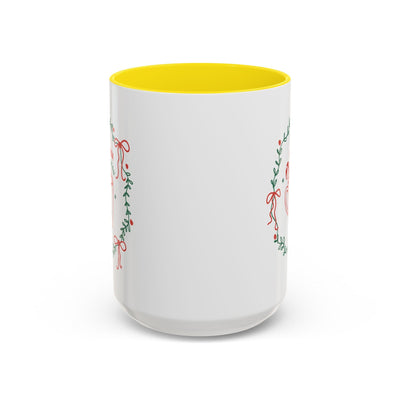 White ceramic mug with yellow interior and festive greenery design, available in 11oz and 15oz sizes