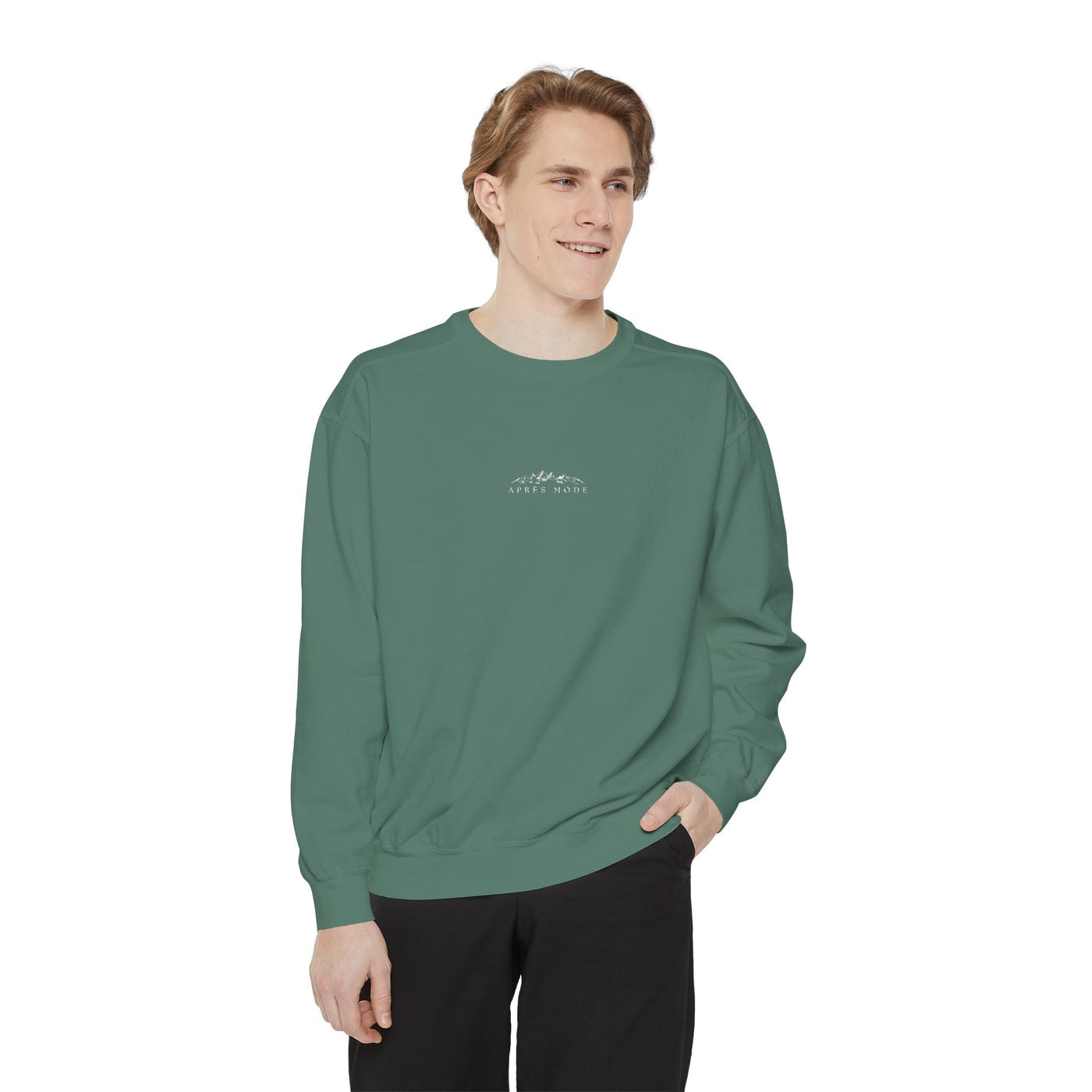 Green unisex sweatshirt with embroidered mountain skiing scene and "Apres Mode" text, relaxed fit, ribbed cuffs and hem