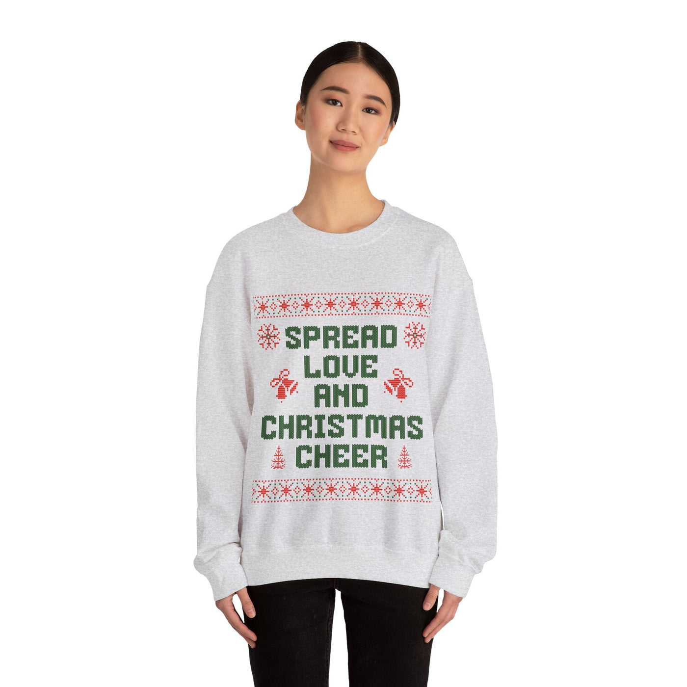 woman wearing gray cozy crewneck sweatshirt with Spread Love and Christmas Cheer holiday design
