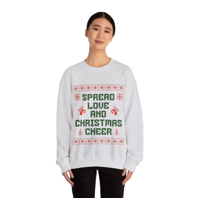 woman wearing gray cozy crewneck sweatshirt with Spread Love and Christmas Cheer holiday design