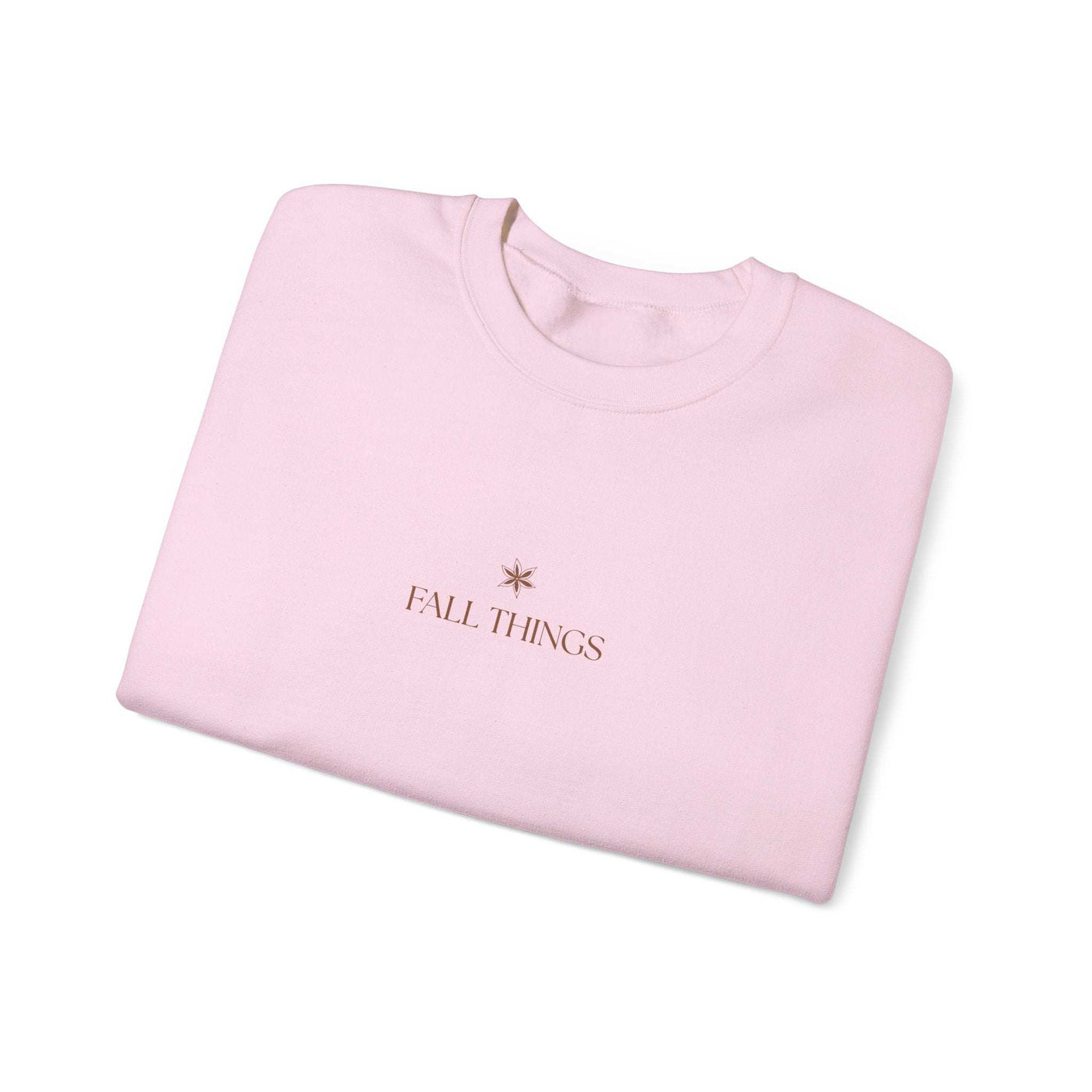 Folded pink Fall Things Sweatshirt with minimalist autumn design for cozy fall wear
