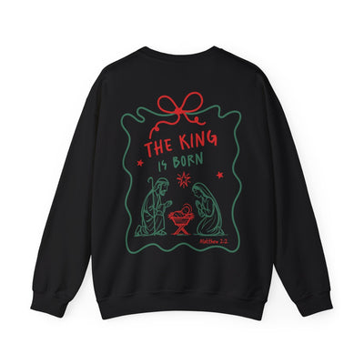 Black Coquette Bow Crewneck Sweatshirt with festive "The King is Born" faith design and Christmas nativity illustration on back