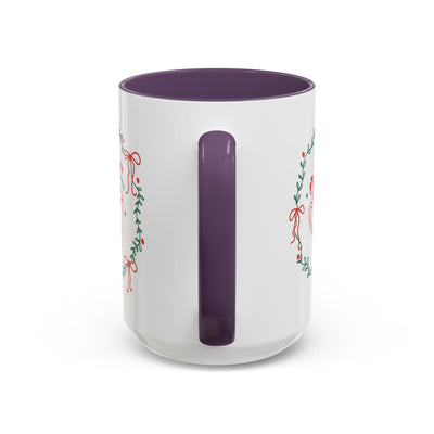 White ceramic mug with purple handle and interior, cozy hot cocoa seasonal design with greenery and red ribbons