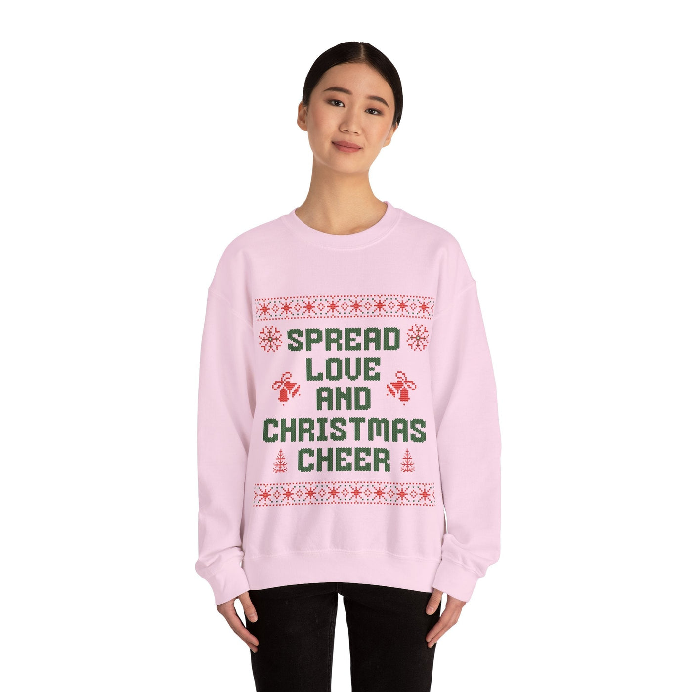Cozy pink crewneck sweatshirt with "Spread Love and Christmas Cheer" holiday design