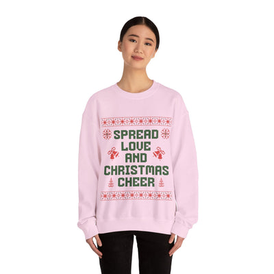 Cozy pink crewneck sweatshirt with "Spread Love and Christmas Cheer" holiday design