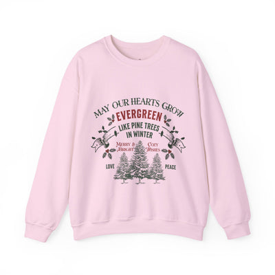 Pink Christmas crewneck sweatshirt with evergreen tree holiday design and festive message
