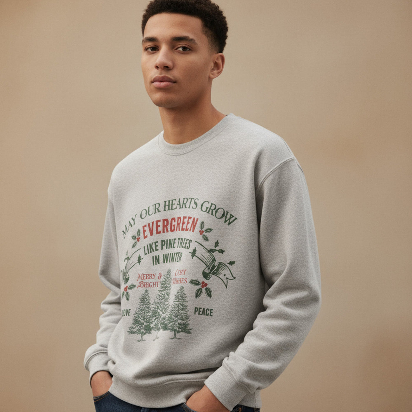 man wearing gray Christmas Crewneck sweatshirt with evergreen holiday design and festive text
