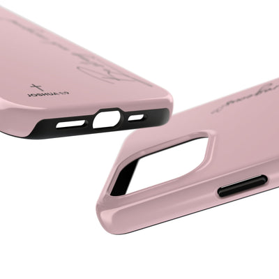 Close-up of pink inspirational tough phone case with "Be Strong and Courageous" Joshua 1:9 scripture text and durable protective design