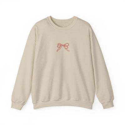 Beige Holiday Bow Crewneck Sweatshirt with red bow design on front, festive winter wear for adults