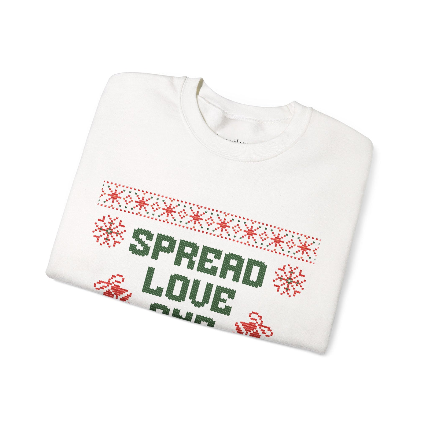 Folded white crewneck sweatshirt with red and green "Spread Love and Christmas Cheer" holiday design