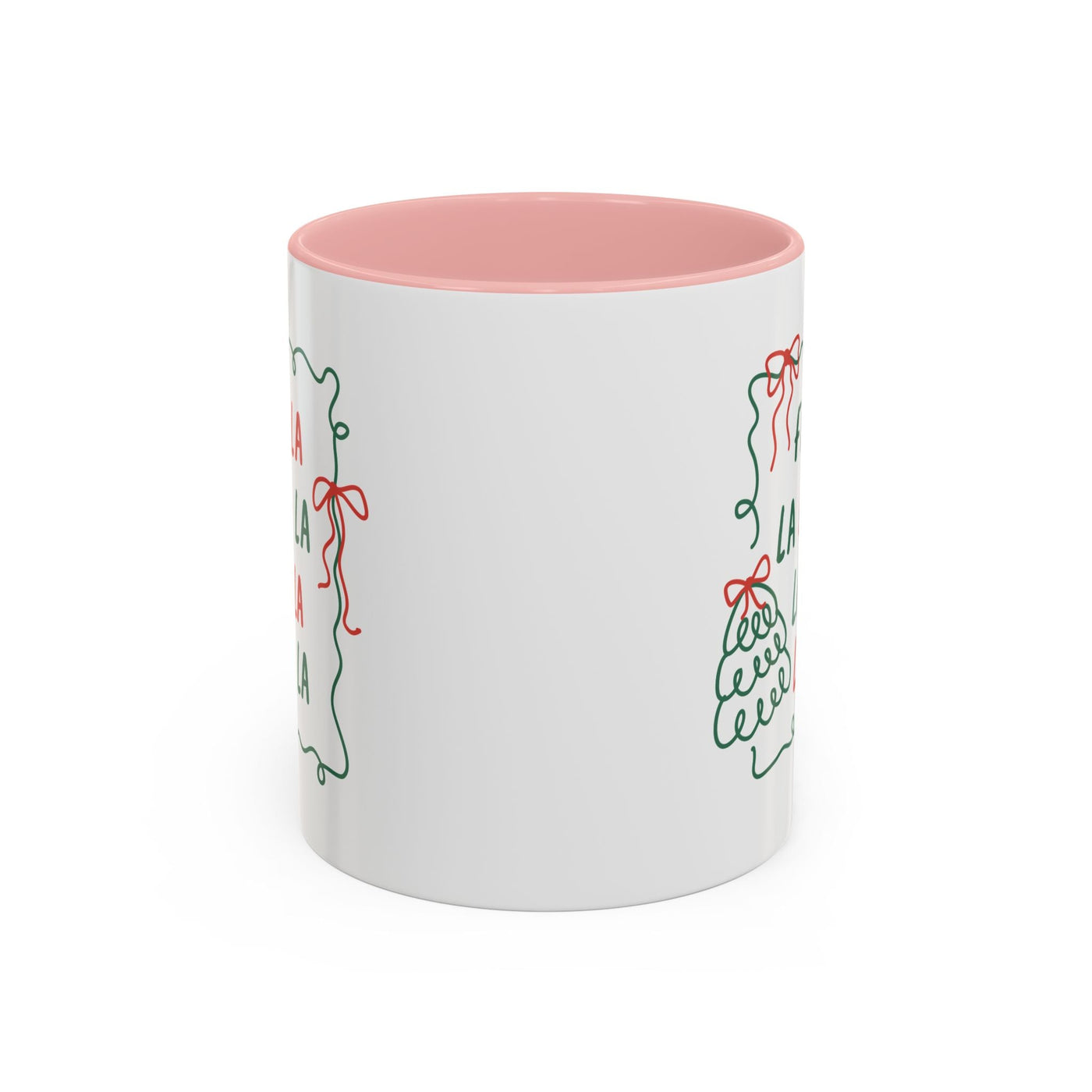 White ceramic Fa La La Christmas coffee mug with minimalist holiday design and pink interior, microwave and dishwasher safe, cozy gift for coffee lovers.