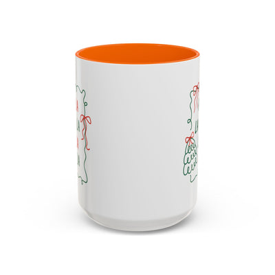 White ceramic Fa La La Christmas coffee mug with orange interior and minimalist holiday design