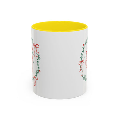 White ceramic mug with yellow interior and festive greenery design, available in 11oz and 15oz sizes