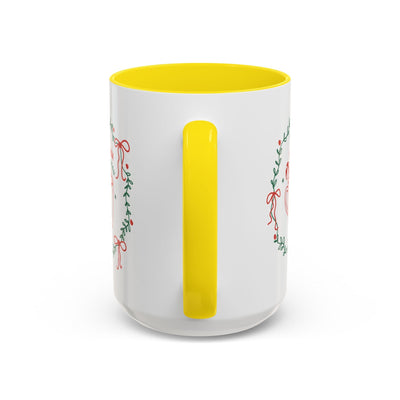 Ceramic mug with white exterior, yellow interior and handle, featuring festive greenery and ribbons design