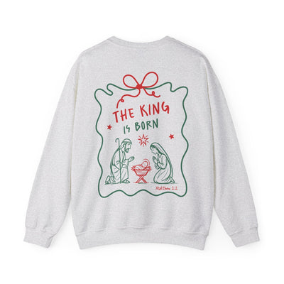 Coquette Bow Crewneck Sweatshirt with festive "The King is Born" faith design on back in red and green.