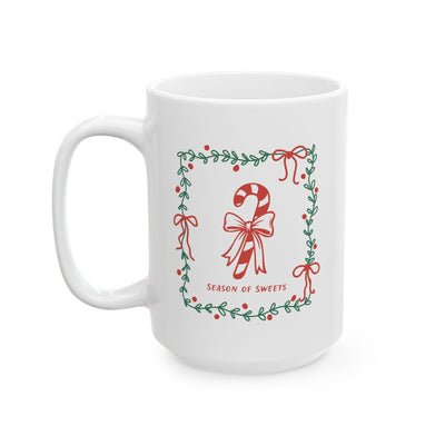 White ceramic mug with green border and candy cane design reading Season of Sweets, available in 11oz and 15oz sizes