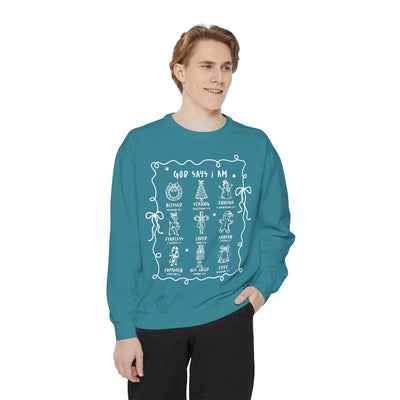 Man wearing teal "God Says I Am" inspirational Bible verse crewneck sweatshirt with embroidered designs