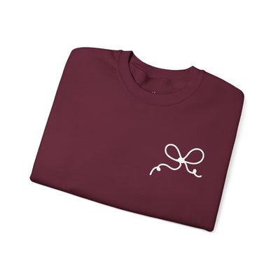 Maroon Coquette Bow Crewneck Sweatshirt with white bow design on front, comfortable cotton-poly blend, festive style.