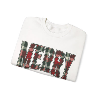 Folded white crewneck sweatshirt with "MERRY" in red and green plaid Christmas graphic design