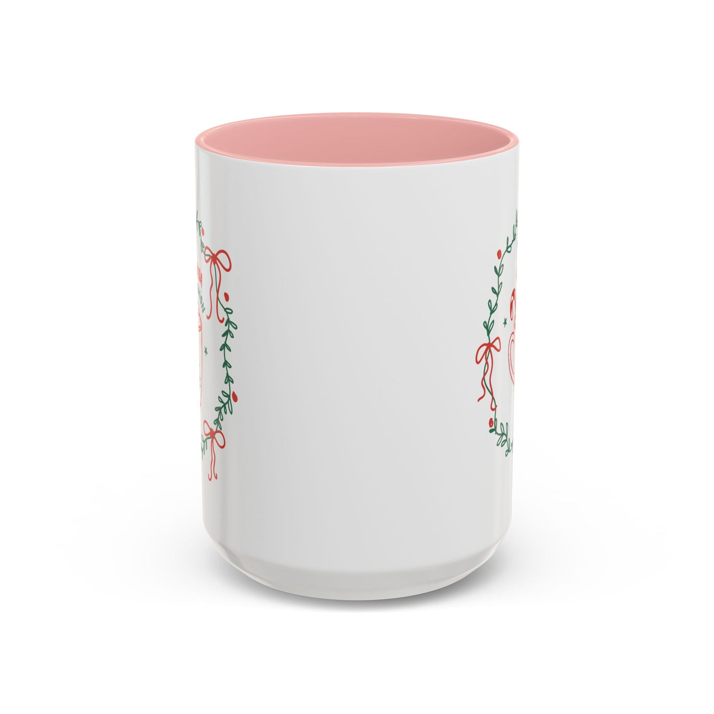 White ceramic mug with red interior and festive greenery design for hot cocoa season