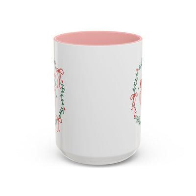 White ceramic mug with red interior and festive greenery design for hot cocoa season
