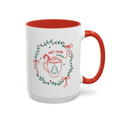 White ceramic mug with red interior and "Hot Cocoa Season" holiday design