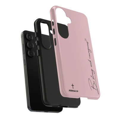 Inspirational tough phone case with Joshua 1:9 scripture, durable dual-layer protection, sleek pink design, and motivational "Be strong and courageous" message for iPhone and Samsung phones.